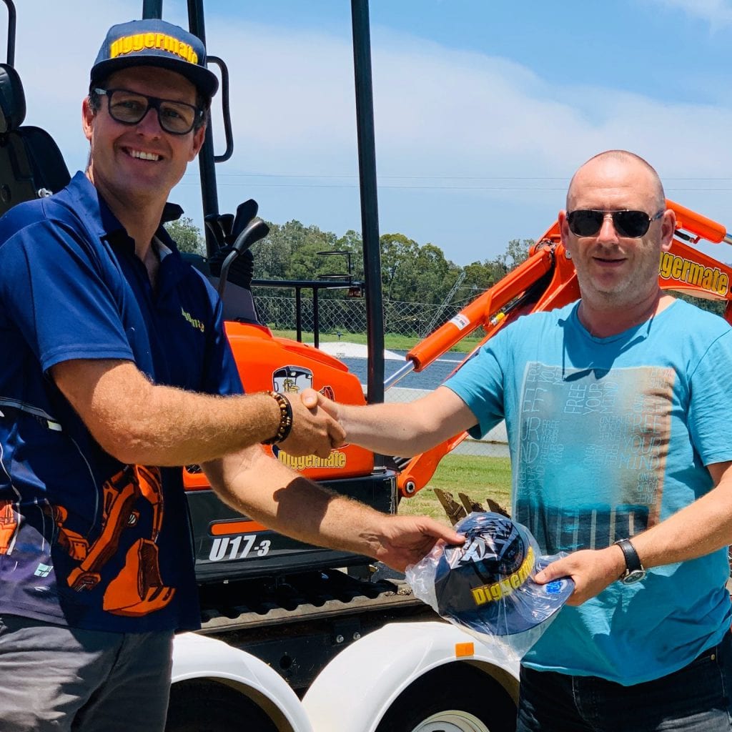 diggermate franchisee shaking the hand of diggermate founder